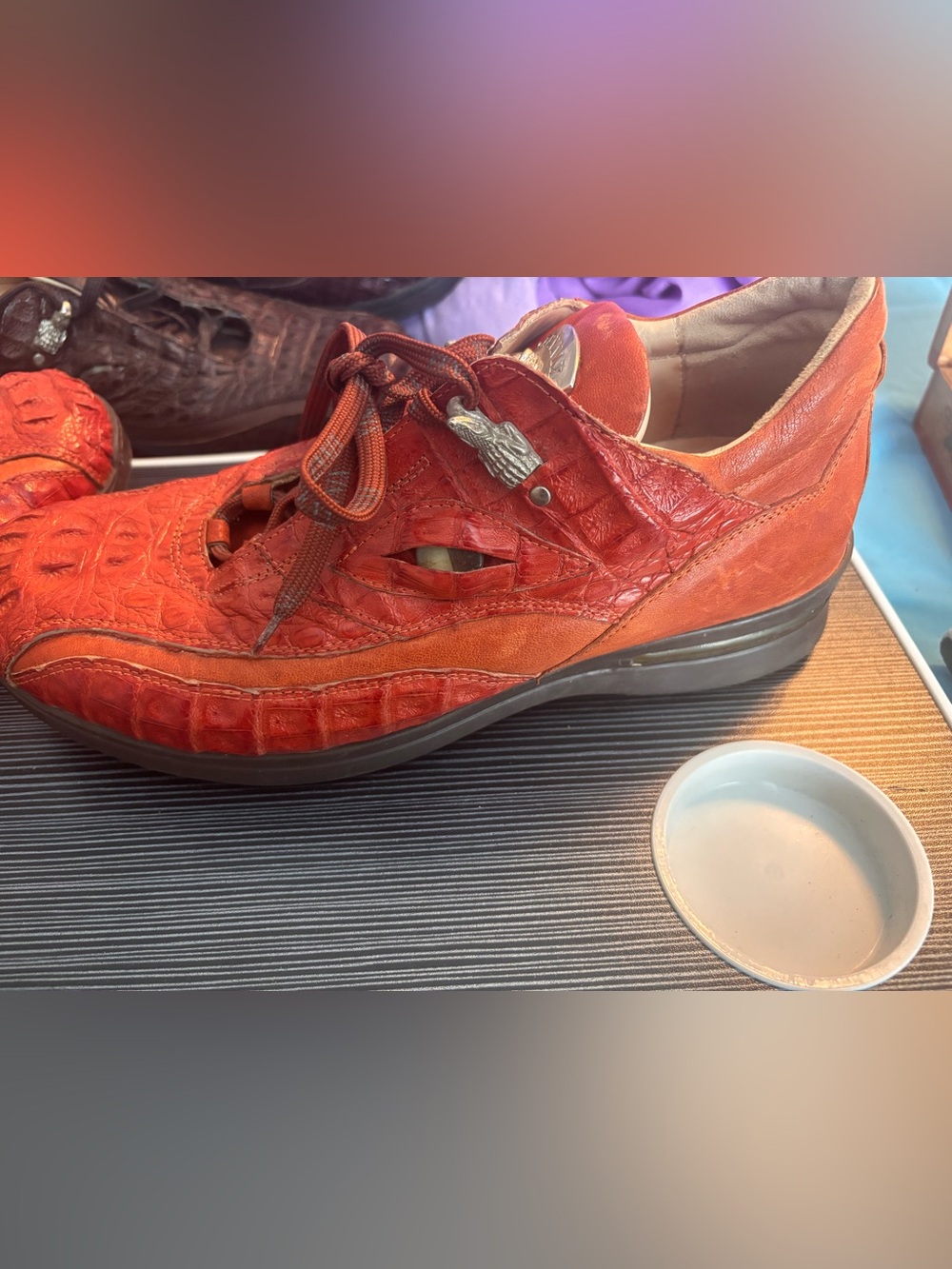 These are orange Fennix Italy hornback alligator skin casual sneakers.